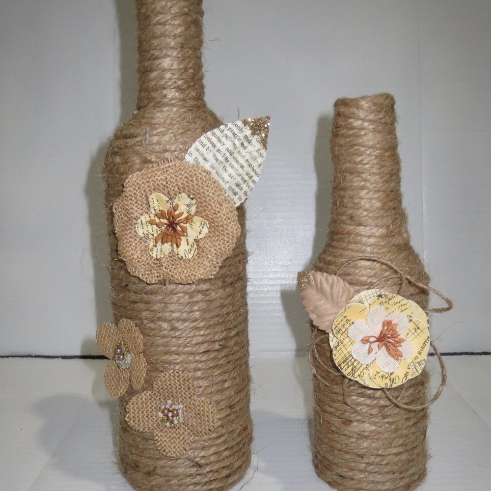 2 Jute wrapped wine bottles/vases. Burlap flowers.